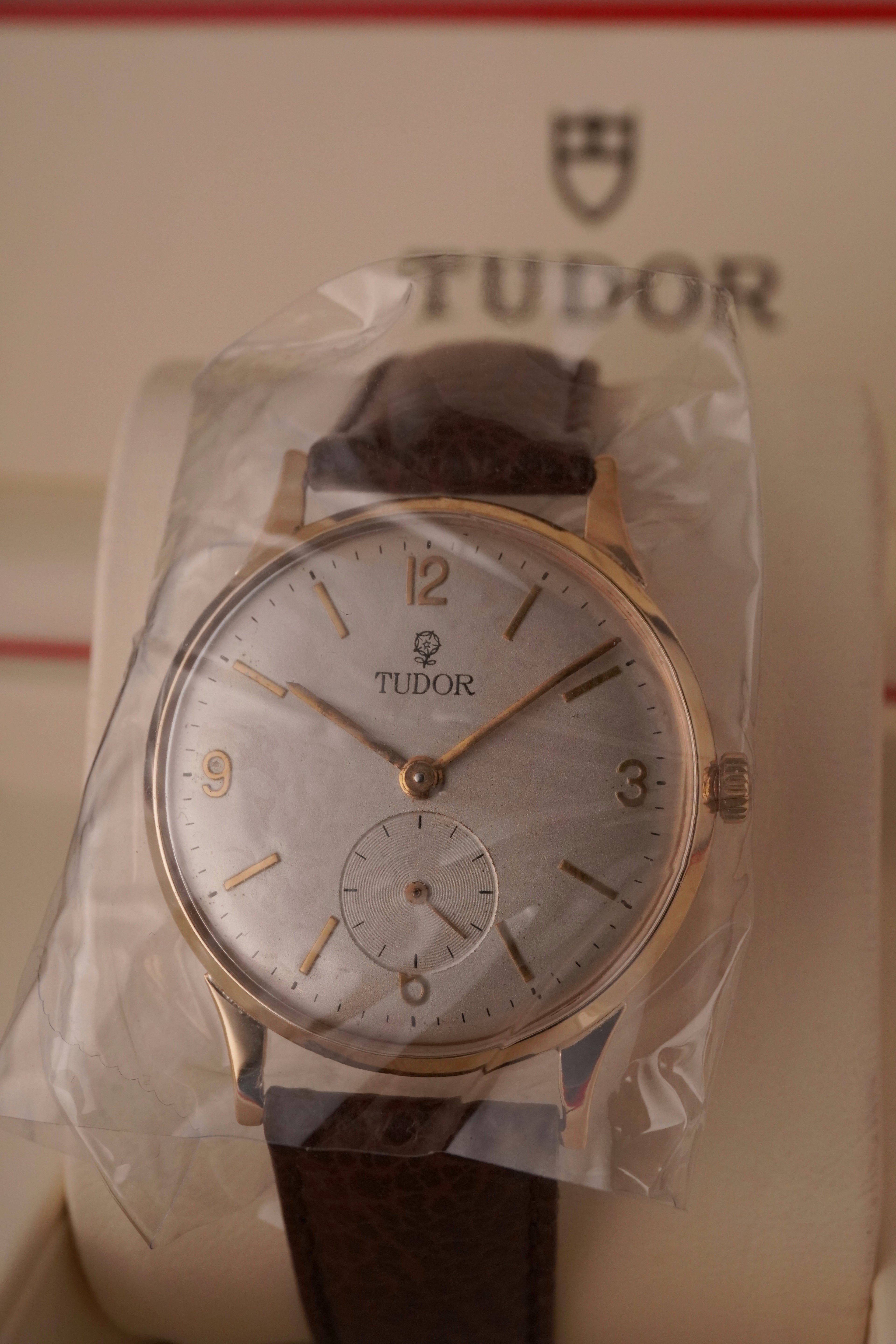 Back from professional case polishing. 
Vintage Tudor 9ct gold dress watch with silver dial, gold hour markers, and small seconds subdial at 6 o’clock on a brown leather strap. 
1960s.